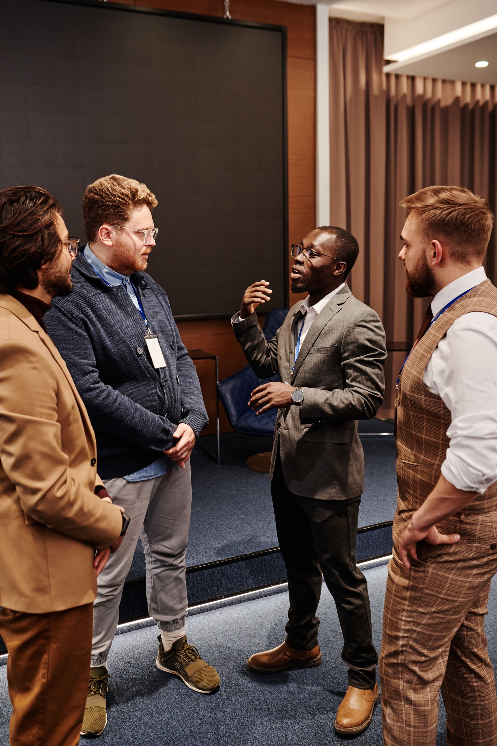 Two delegates shaking hands at a networking event