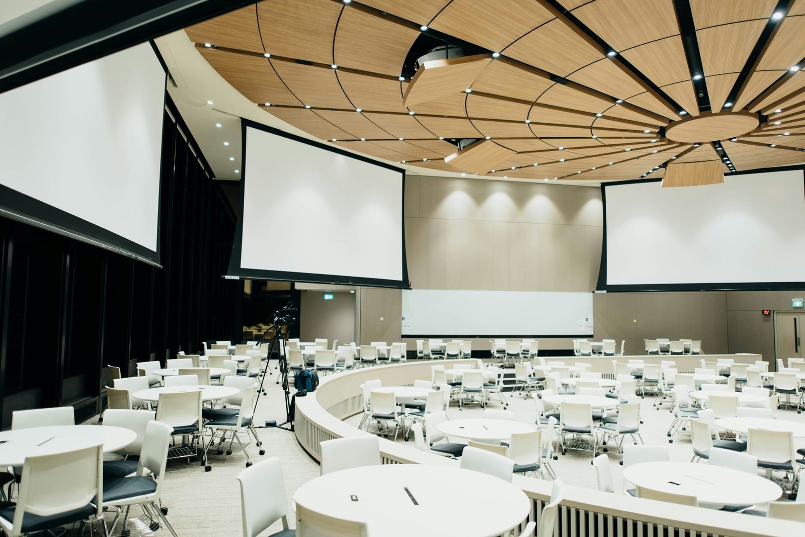 Elegantly decorated event hall with dressed tables and lighting